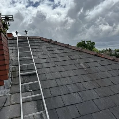 Ridge tile replacement and repointing work on pitched roof in Merseyside